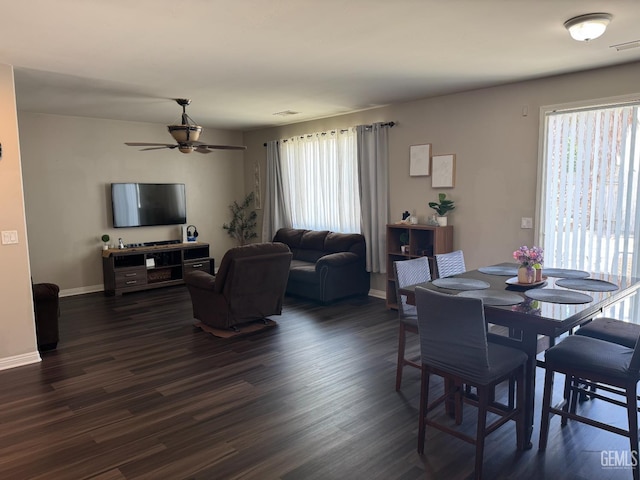11908 Nebula Ct, Bakersfield, CA 93312 - dining area with plenty of natural light, a ceiling fan, dark wood-type flooring, and baseboards