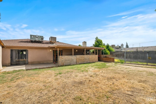 1125 Rose Ave, Shafter, CA 93263 - back of house featuring a patio area, stucco siding, and central AC
