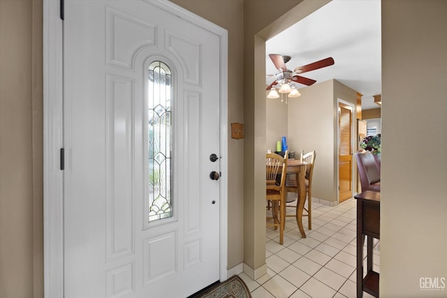 entrance foyer featuring ceiling fan and light tile patterned flooring