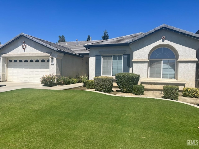 ranch-style house with a front yard and a garage