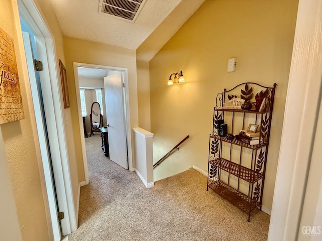 4600 Beechwood St Unit 135, Bakersfield, CA 93309 - corridor featuring an upstairs landing, carpet floors, and baseboards