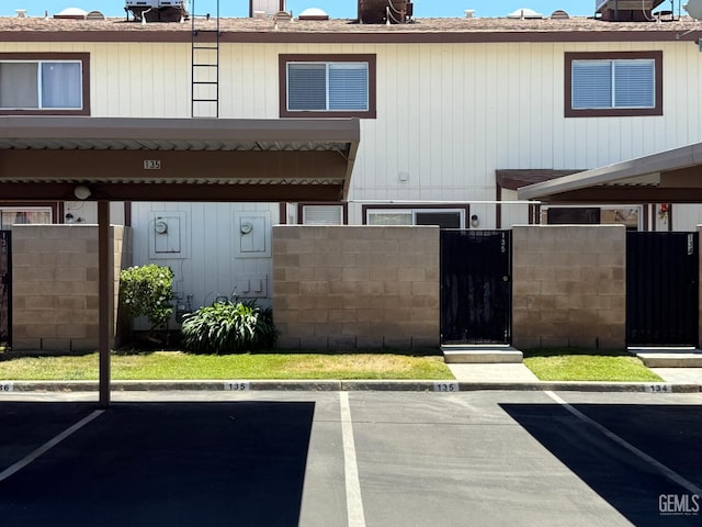 4600 Beechwood St Unit 135, Bakersfield, CA 93309 - partially covered parking lot with a gate
