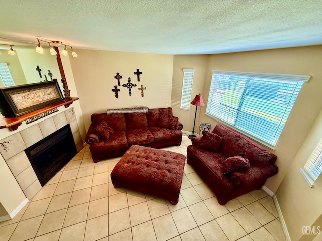 4600 Beechwood St Unit 135, Bakersfield, CA 93309 - living area featuring a tile fireplace, light tile patterned flooring, and a textured ceiling