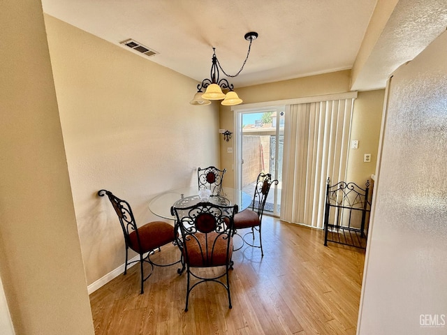 4600 Beechwood St Unit 135, Bakersfield, CA 93309 - dining room featuring wood finished floors and baseboards