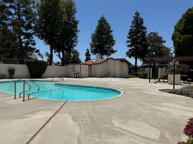 4600 Beechwood St Unit 135, Bakersfield, CA 93309 - view of swimming pool with a patio