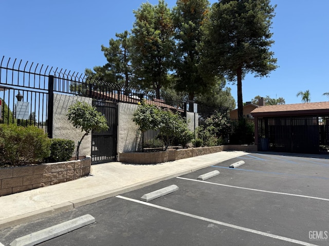 4600 Beechwood St Unit 135, Bakersfield, CA 93309 - uncovered parking lot featuring a gate