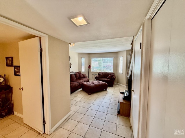 4600 Beechwood St Unit 135, Bakersfield, CA 93309 - living area with light tile patterned floors and baseboards