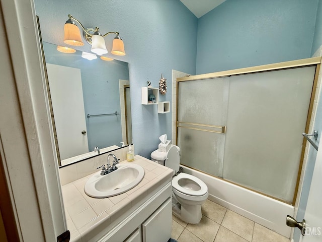 4600 Beechwood St Unit 135, Bakersfield, CA 93309 - full bath with toilet, vanity, tile patterned floors, and shower / bath combination with glass door