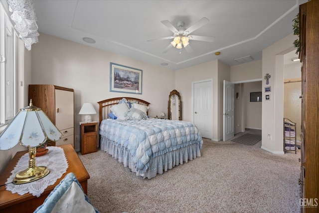 bedroom featuring visible vents, ceiling fan, carpet, and baseboards