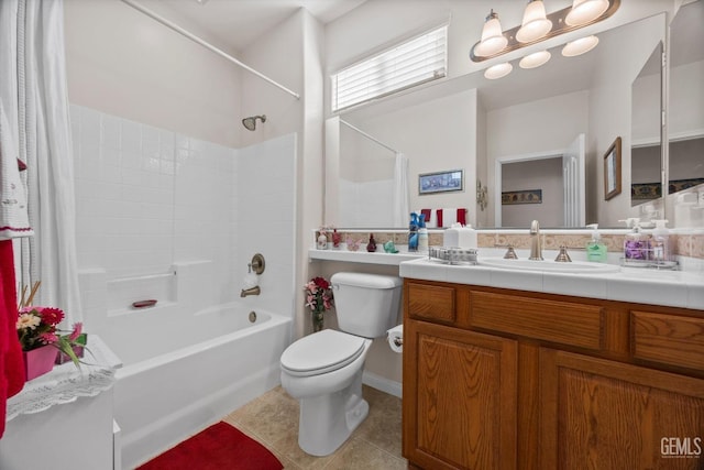 full bath with tile patterned floors, vanity, toilet, and shower / bath combination with curtain