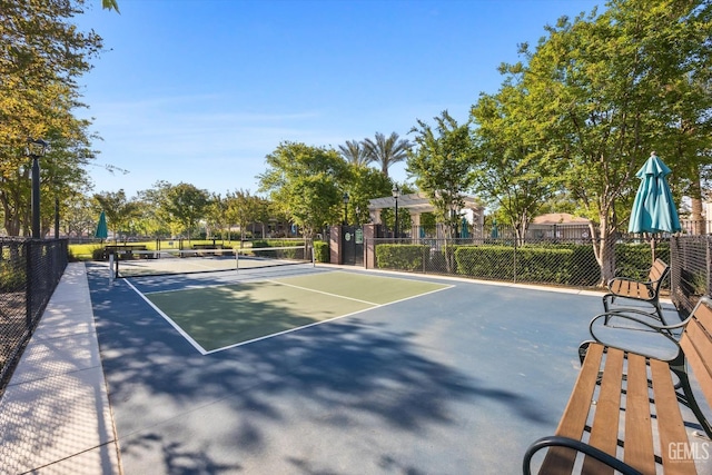 view of sport court with fence
