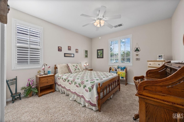 bedroom featuring visible vents, ceiling fan, baseboards, and carpet floors
