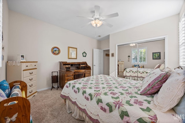 carpeted bedroom featuring ceiling fan, baseboards, and a closet