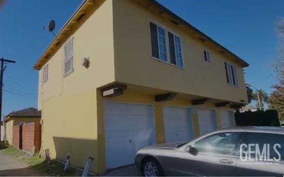 view of side of property featuring a garage