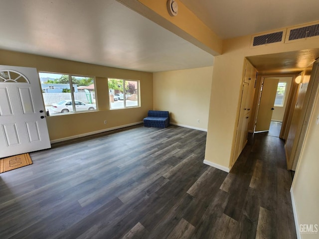 4856 Morales St, New Cuyama, CA 93254 - unfurnished living room featuring dark wood-type flooring and baseboards