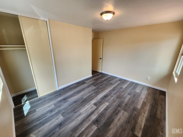 4856 Morales St, New Cuyama, CA 93254 - unfurnished bedroom featuring dark wood-style flooring, baseboards, and a closet