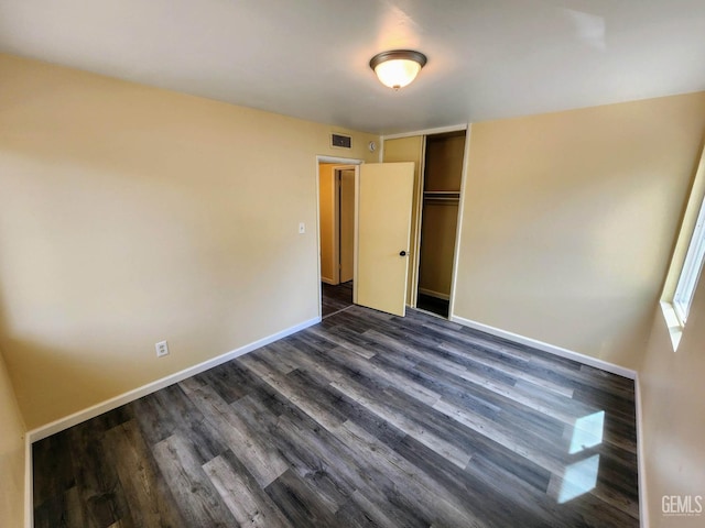 4856 Morales St, New Cuyama, CA 93254 - unfurnished bedroom with dark wood finished floors, baseboards, and a closet