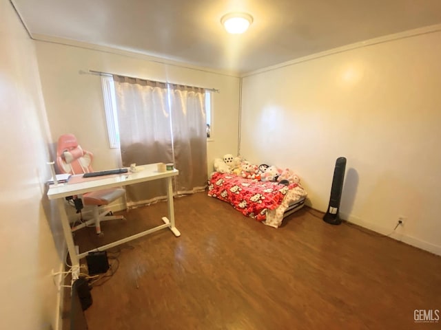 bedroom featuring dark hardwood / wood-style flooring