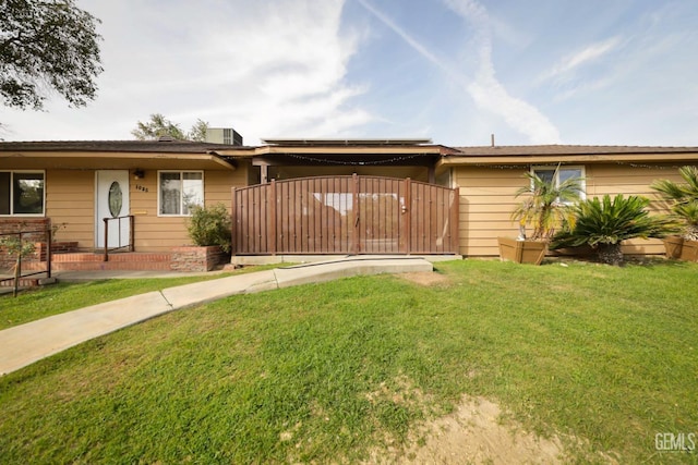 ranch-style house with a front lawn