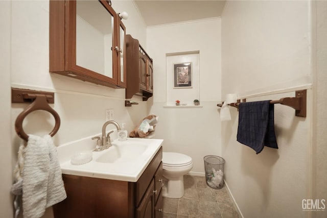 bathroom featuring vanity, toilet, and crown molding