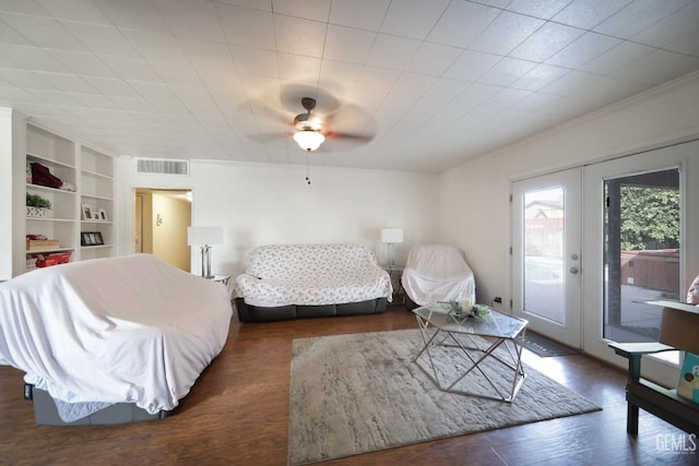 bedroom with access to outside, ceiling fan, french doors, and dark hardwood / wood-style floors