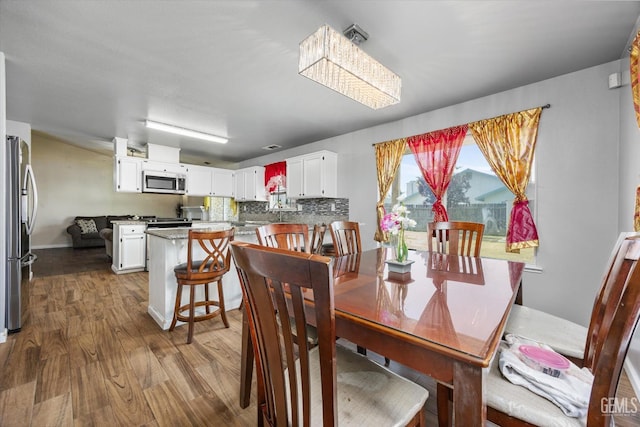 1914 Hummingbird Ave, Delano, CA 93215 - dining area with wood finished floors and baseboards