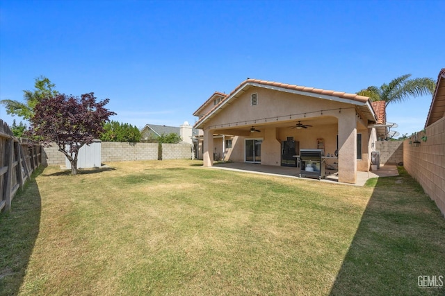 1914 Hummingbird Ave, Delano, CA 93215 - back of house featuring a ceiling fan, stucco siding, a patio, and a tile roof