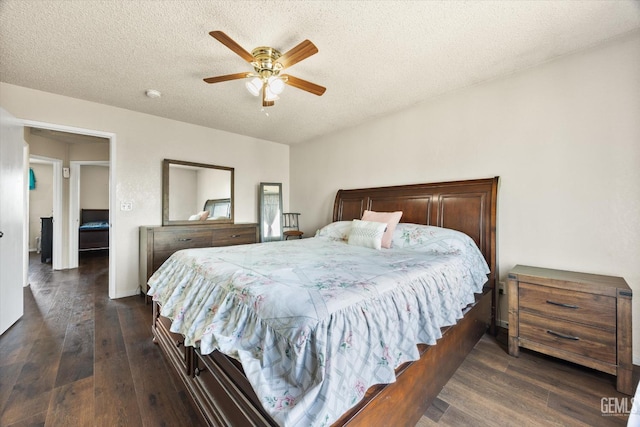 1914 Hummingbird Ave, Delano, CA 93215 - bedroom with dark wood-type flooring, a textured ceiling, ceiling fan, and baseboards