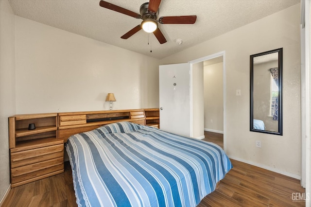 1914 Hummingbird Ave, Delano, CA 93215 - bedroom featuring dark wood-style floors, baseboards, a textured ceiling, lofted ceiling, and ceiling fan