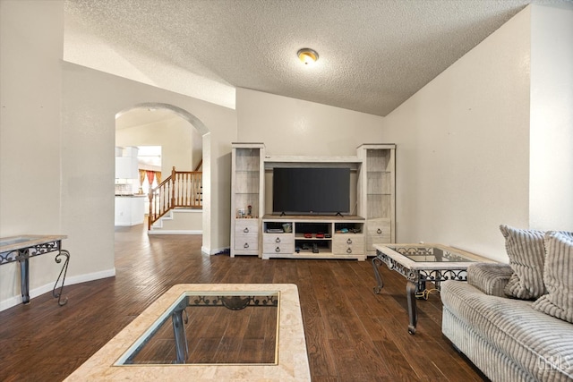 1914 Hummingbird Ave, Delano, CA 93215 - living area with lofted ceiling, wood finished floors, a textured ceiling, arched walkways, and stairs
