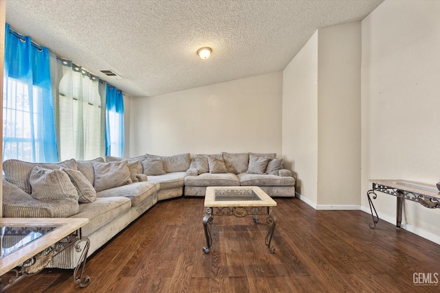 1914 Hummingbird Ave, Delano, CA 93215 - living room with a textured ceiling, wood finished floors, and baseboards