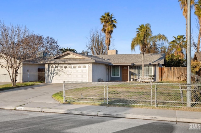 single story home featuring a garage and a front yard