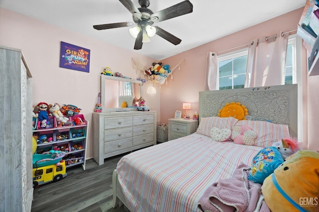 bedroom featuring dark hardwood / wood-style flooring and ceiling fan