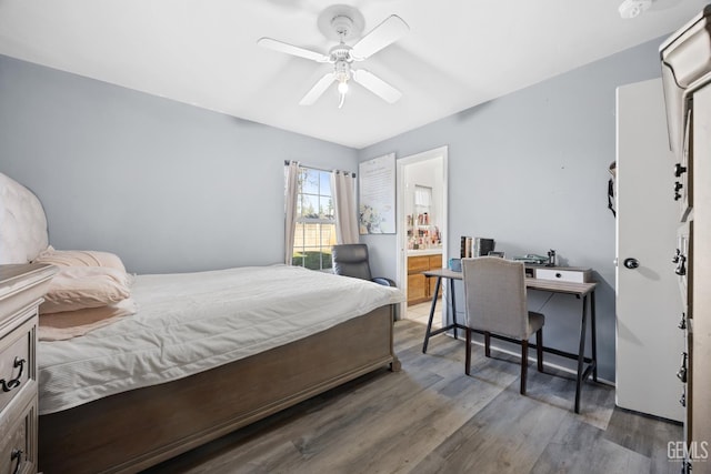 bedroom with dark hardwood / wood-style floors and ceiling fan