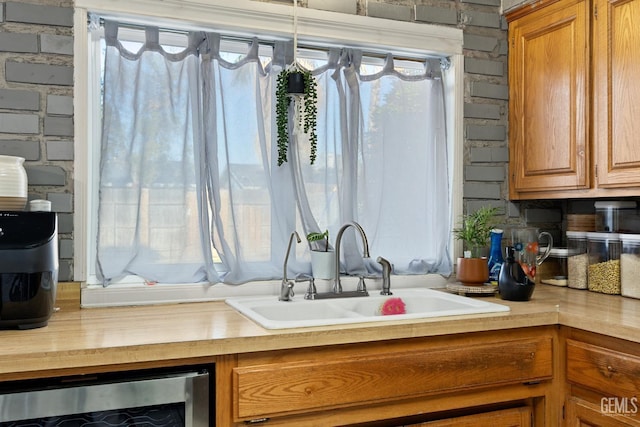 kitchen with beverage cooler and sink