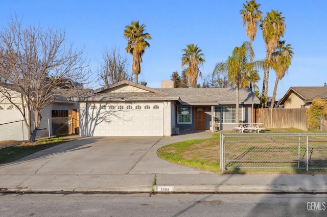 ranch-style home with a garage and a front lawn