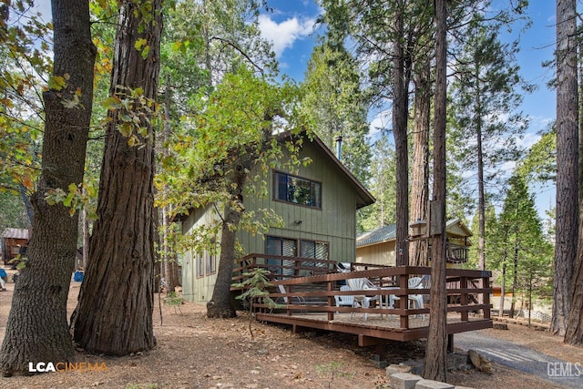 back of property with a wooden deck