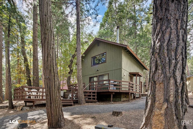 back of property with a wooden deck