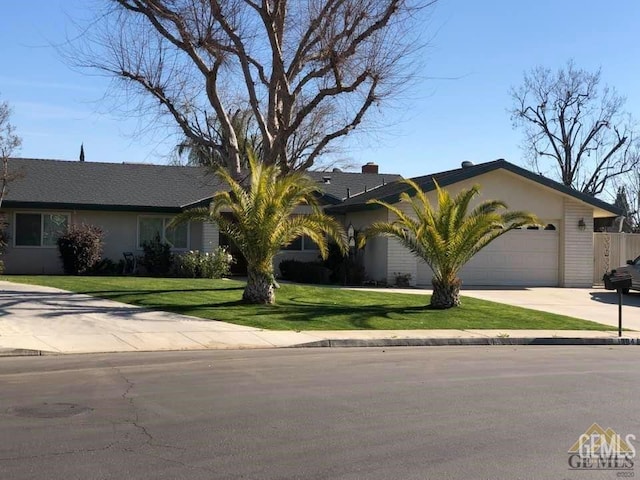 ranch-style home featuring a garage and a front yard