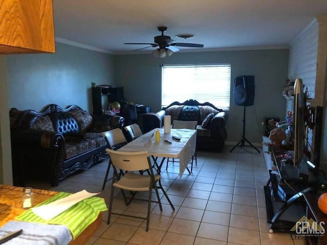 dining room featuring ornamental molding, tile patterned floors, and ceiling fan