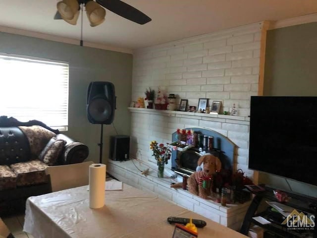 interior space with ornamental molding and ceiling fan