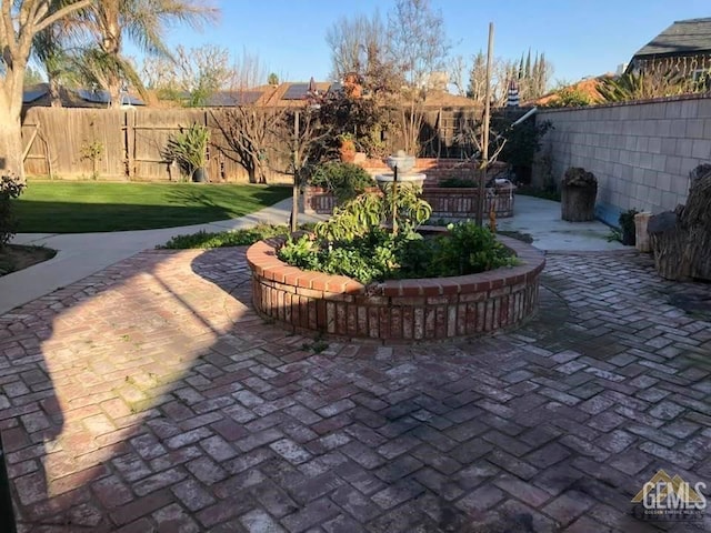 view of property's community with a patio and a yard