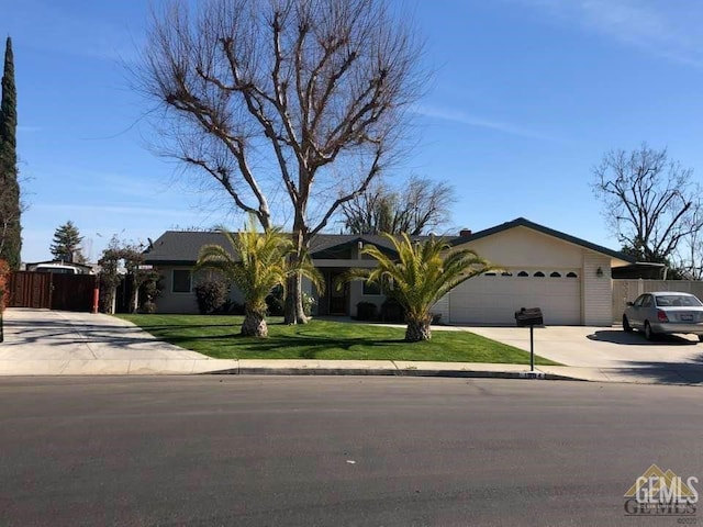 ranch-style home with a garage and a front lawn