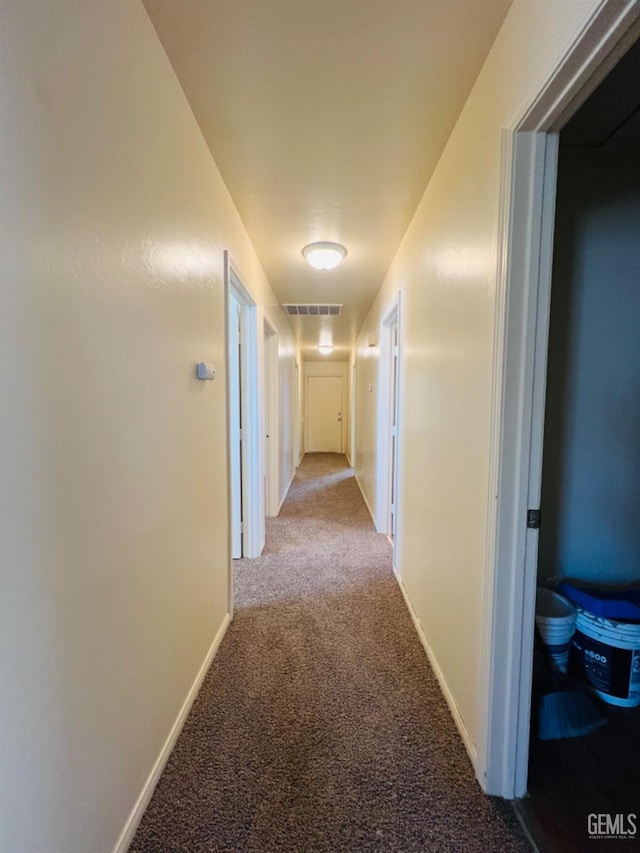 corridor with light colored carpet