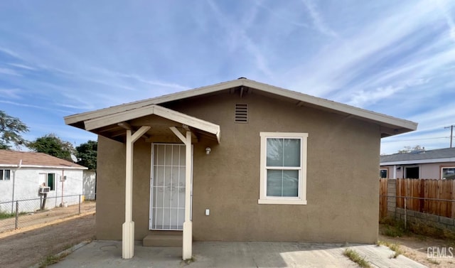 rear view of property with a patio area