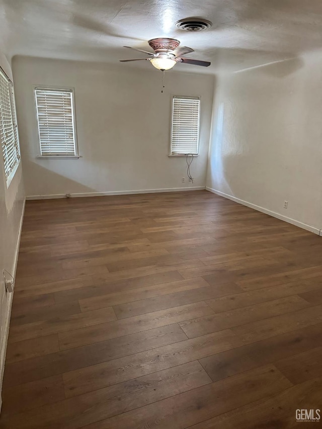 spare room with dark hardwood / wood-style floors