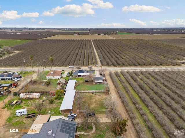 birds eye view of property with a rural view