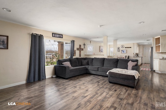 living room featuring dark wood-type flooring