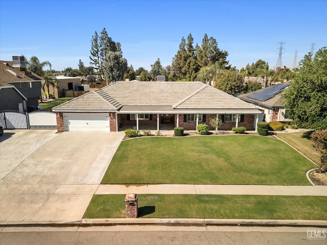 ranch-style home featuring a front lawn and a garage