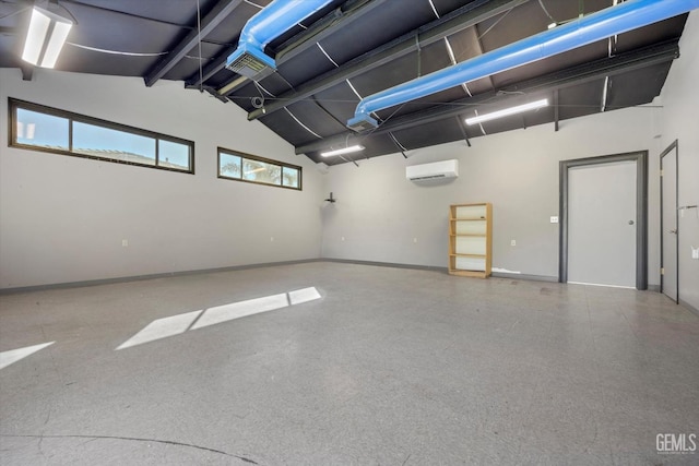 garage featuring a wall mounted AC